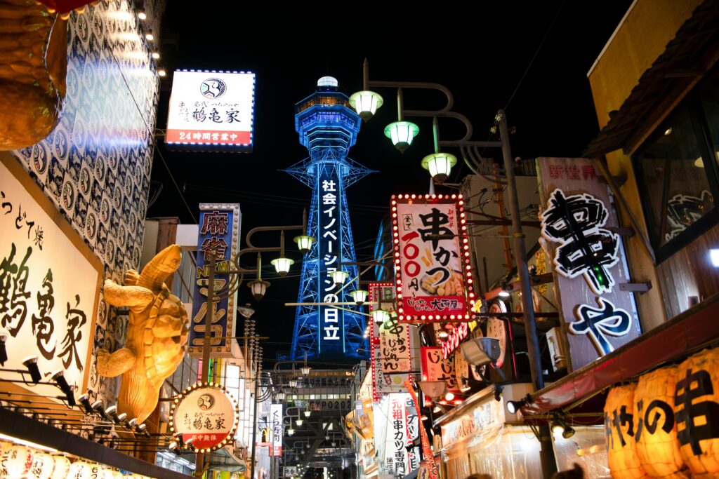 Shinsekai neighborhood in Osaka with retro signs, kushikatsu restaurants, and Tsutenkaku Tower