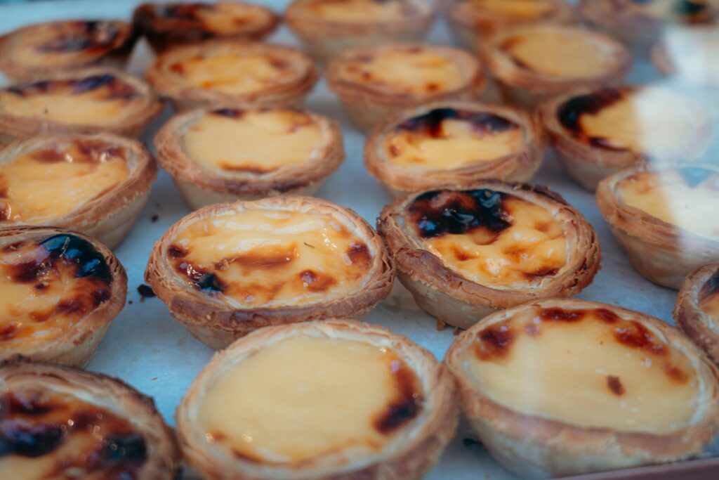 Fresh pasteis de nata Portuguese custard tarts in Lisbon bakery