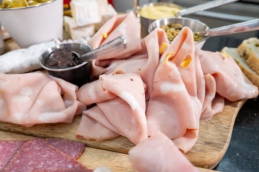 Delicious board of sliced mortadella.